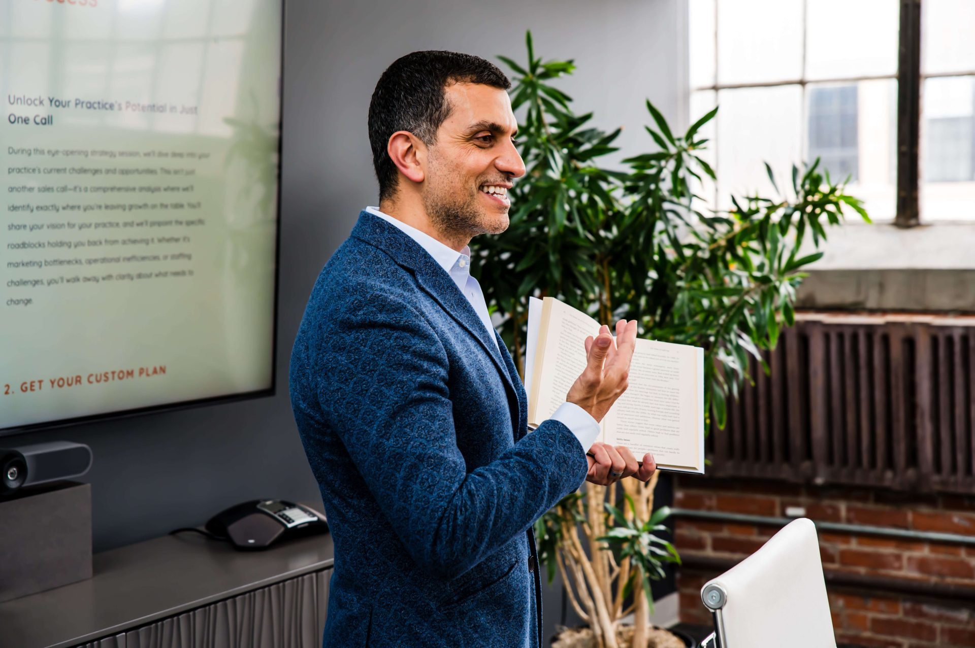 Dr. Charbel Harb presenting business insights to chiropractors