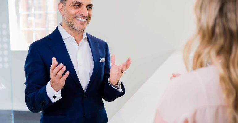 Dr. Charbel Harb mentoring clinic owners on growth session