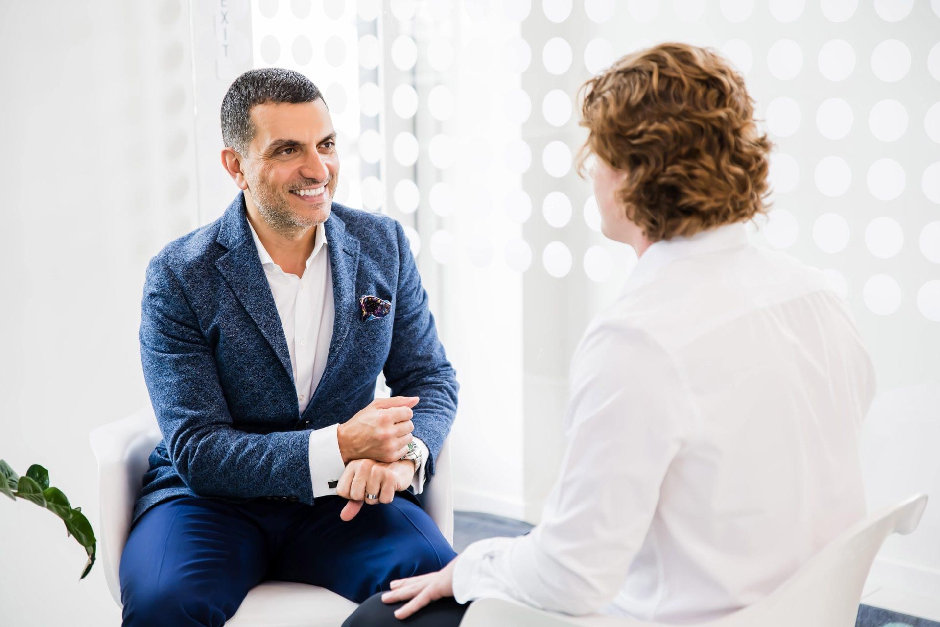 Dr. Charbel Harb chiropractic business coach in discussion